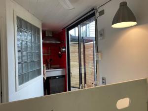 a kitchen with a mirror and a sink in a room at French Andes Apart & Chile Campers Rental in Pucón