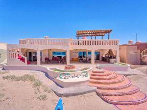 a large house with a skate park in front of it at Casa San Miguel - Beachfront House in Playa Encanto
