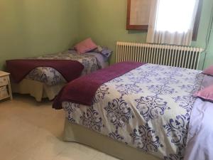 A bed or beds in a room at Casa Rural Cal Farragetes
