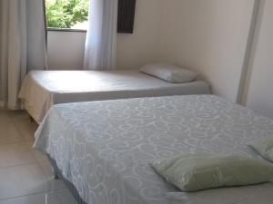 Cama o camas de una habitación en Lugar Paradisiaco 200 m praia