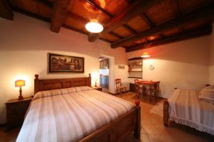 Postel nebo postele na pokoji v ubytování Agriturismo Monte Valentino
