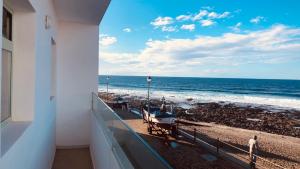 a balcony with a view of the ocean at CASA ANCLADA en LA SANTA- 4 Apartamentos frente al mar- 1ª linea solarium in La Santa