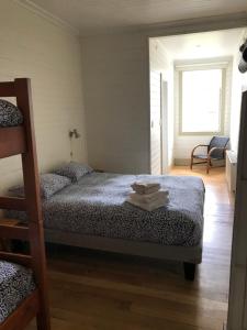 Postel nebo postele na pokoji v ubytování Hostal Compass del Sur