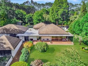 an aerial view of a house with a yard at Normandie Park Exeter in Exeter