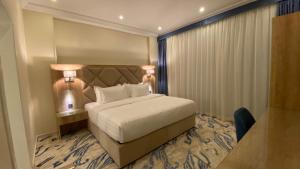 Giường trong phòng chung tại ماس للشقق الفندقية الفاخرة