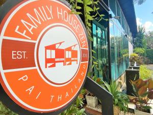 a sign for a family house outside of a building at Family House Zen Boutique Resort in Pai