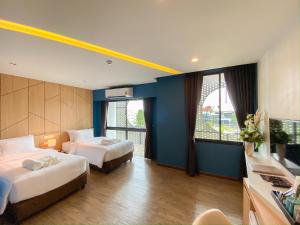 Ένα ή περισσότερα κρεβάτια σε δωμάτιο στο Hotel Fuse Rayong