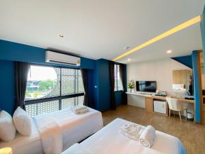 Ένα ή περισσότερα κρεβάτια σε δωμάτιο στο Hotel Fuse Rayong