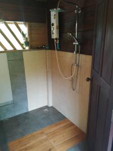 a shower in a bathroom with a shower at Fandee Island - Treehouses, Tiny Houses & Zipline - Tad Lo, Boloven Loop Pakse in Tad Lo +80 photos