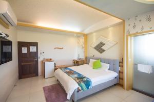 En eller flere senger på et rom på Lanyang Beach Villa
