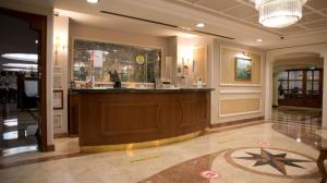 a large room with a large counter and a large window at Taksim Metropark Hotel in Istanbul