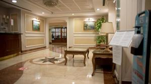 a lobby with a table and a star on the floor at Taksim Metropark Hotel in Istanbul