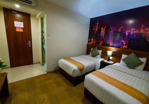 Ein Bett oder Betten in einem Zimmer der Unterkunft Miyanna Hotel