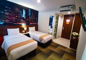Ein Bett oder Betten in einem Zimmer der Unterkunft Miyanna Hotel