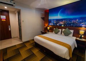 Ein Bett oder Betten in einem Zimmer der Unterkunft Miyanna Hotel