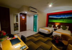 Ein Bett oder Betten in einem Zimmer der Unterkunft Miyanna Hotel