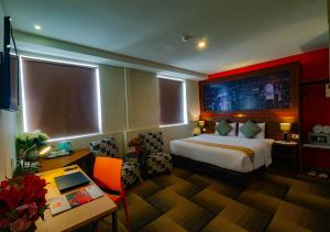 Ein Bett oder Betten in einem Zimmer der Unterkunft Miyanna Hotel