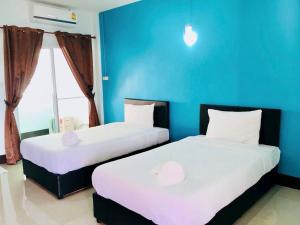 Letto o letti in una camera di Chat House Soi 18 Mithuna Chiangrai