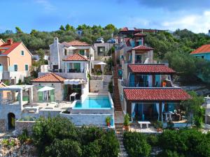 an aerial view of a house with a swimming pool at Villa Kamen Green in Vela Luka