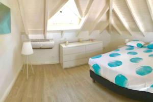 A bed or beds in a room at V2 Dream panorama of the ocean