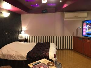 Llit o llits en una habitació de Hotel Fairy Tale (Adult Only)