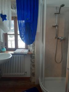 a bathroom with a shower and a sink at B&B Alpe Veglia in Varzo