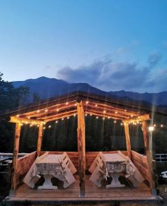a stage with lights on it with mountains in the background at Agriturismo Al Castagno in Abetone