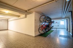 a room with bikes hanging on the wall at Waldhof 1 - Waldhof 4 by Arosa Holiday in Arosa