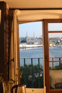 a window with a view of the water at Fanus Suites Karaköy in Istanbul