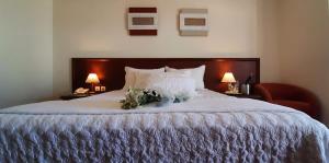 
Кровать или кровати в номере Porto Alegre Hotel
