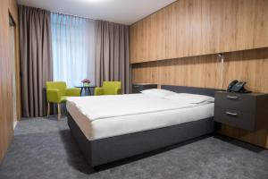 Postel nebo postele na pokoji v ubytování Hotel Zdravilisce - Thermana Lasko