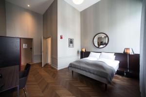 Кровать или кровати в номере Bergen Børs Hotel