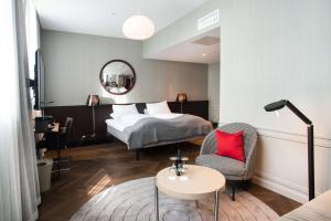 Кровать или кровати в номере Bergen Børs Hotel
