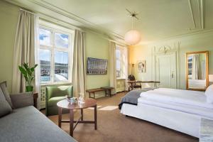 Postel nebo postele na pokoji v ubytování Grand Hotel Terminus