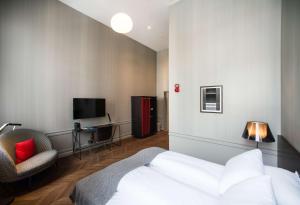 Кровать или кровати в номере Bergen Børs Hotel