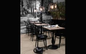 
a dining room table with chairs and lamps at Saga Hotel Oslo; BW Premier Collection in Oslo
