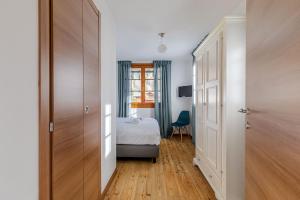 Postel nebo postele na pokoji v ubytování Hotel Dufour