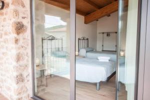 Posteľ alebo postele v izbe v ubytovaní La Cabanya Planella + 27 fotografií