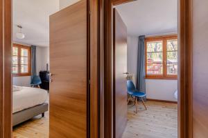 Postel nebo postele na pokoji v ubytování Hotel Dufour