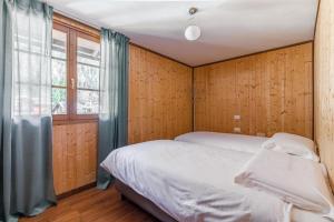 Postel nebo postele na pokoji v ubytování Hotel Dufour