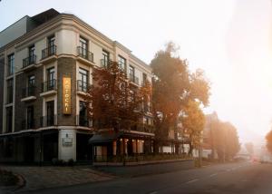a building on the side of a street at Potocki Boutique Hotel in Khmelnytskyi