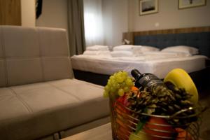 A bed or beds in a room at AquaSun Family Hotel