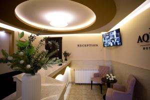 A television and/or entertainment centre at AquaSun Family Hotel