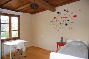 Llit o llits en una habitació de Casa Rural El Entamáu