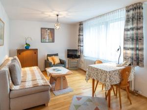 a living room with a couch and a table at Birkenhof Apartments in Bad Endorf