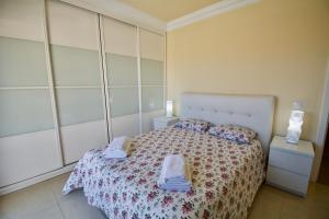 A bed or beds in a room at Villa Lovisi