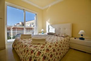 A bed or beds in a room at Villa Lovisi
