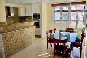 A kitchen or kitchenette at Villa Lovisi