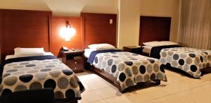 Rúm í herbergi á Hotel Castilla