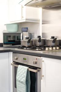 a kitchen with pots and pans on a stove at No4 Nursery Convent in Mansfield